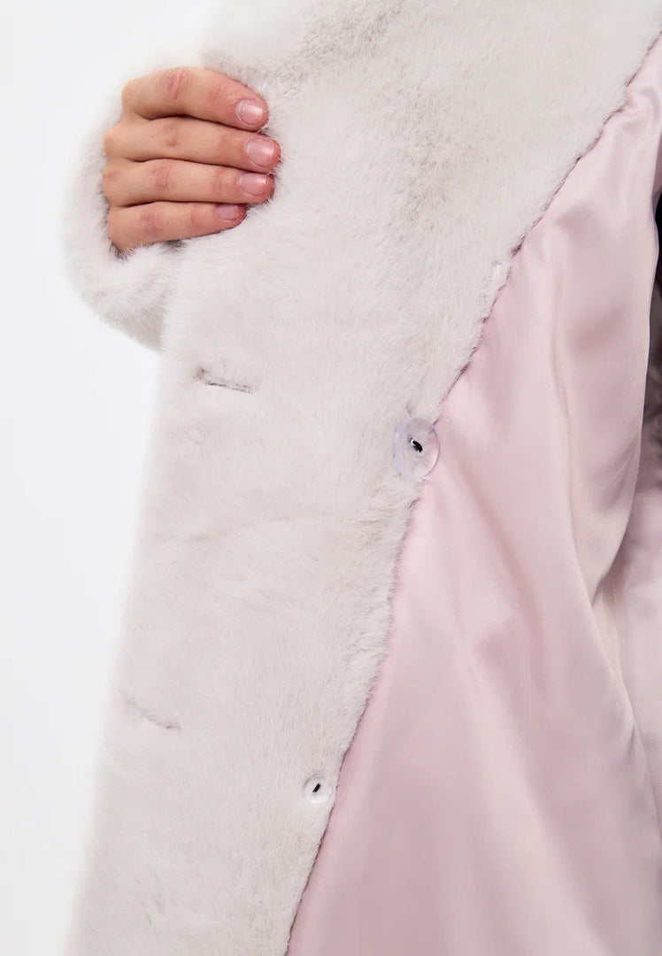 A stylish white Miriam faux fur double-buttoned coat, a must-have for your winter fashion wardrobe.