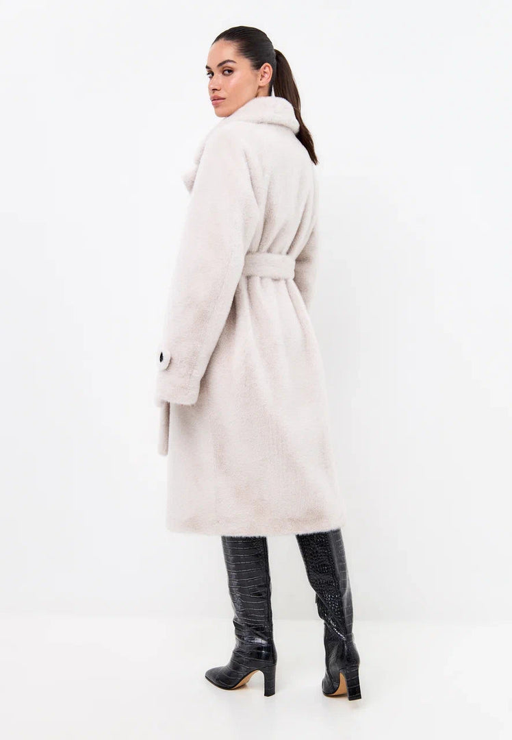 A chic winter fashion coat in white, featuring a double-buttoned design and faux fur accents, known as the Miriam coat.