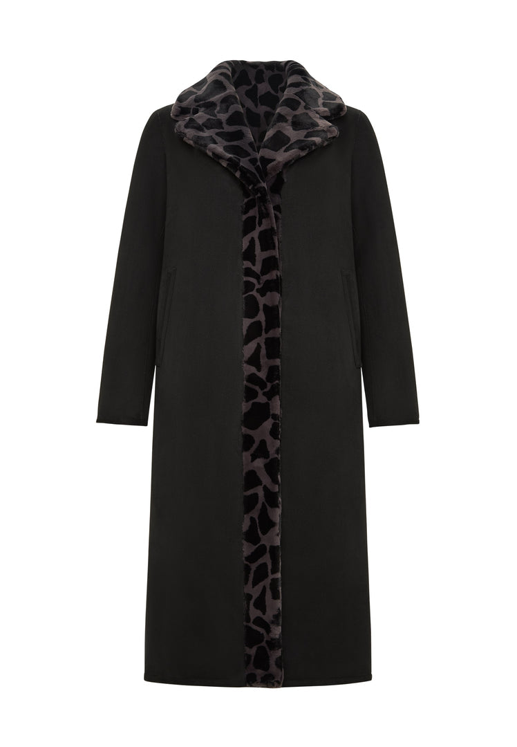 A stylish reversible animal print coat with faux fur Pantera on one side and black fur on the other, making it a versatile and trendy piece of animal print outerwear for the fashion-forward winter wardrobe.