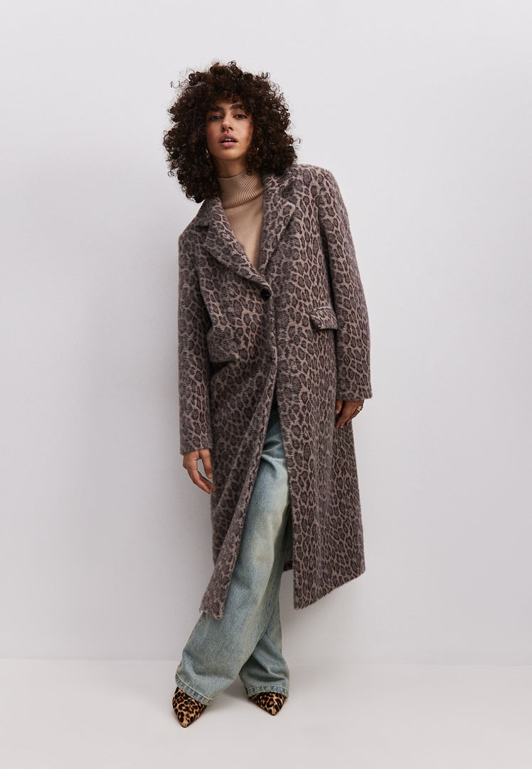 A stylish Bianca coat, featuring a luxurious faux fur leopard print design in a long silhouette, perfect for cold weather fashion.