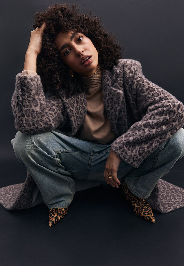 A stylish Bianca coat, featuring a faux fur leopard print design, perfect for staying warm and on-trend in the colder weather.