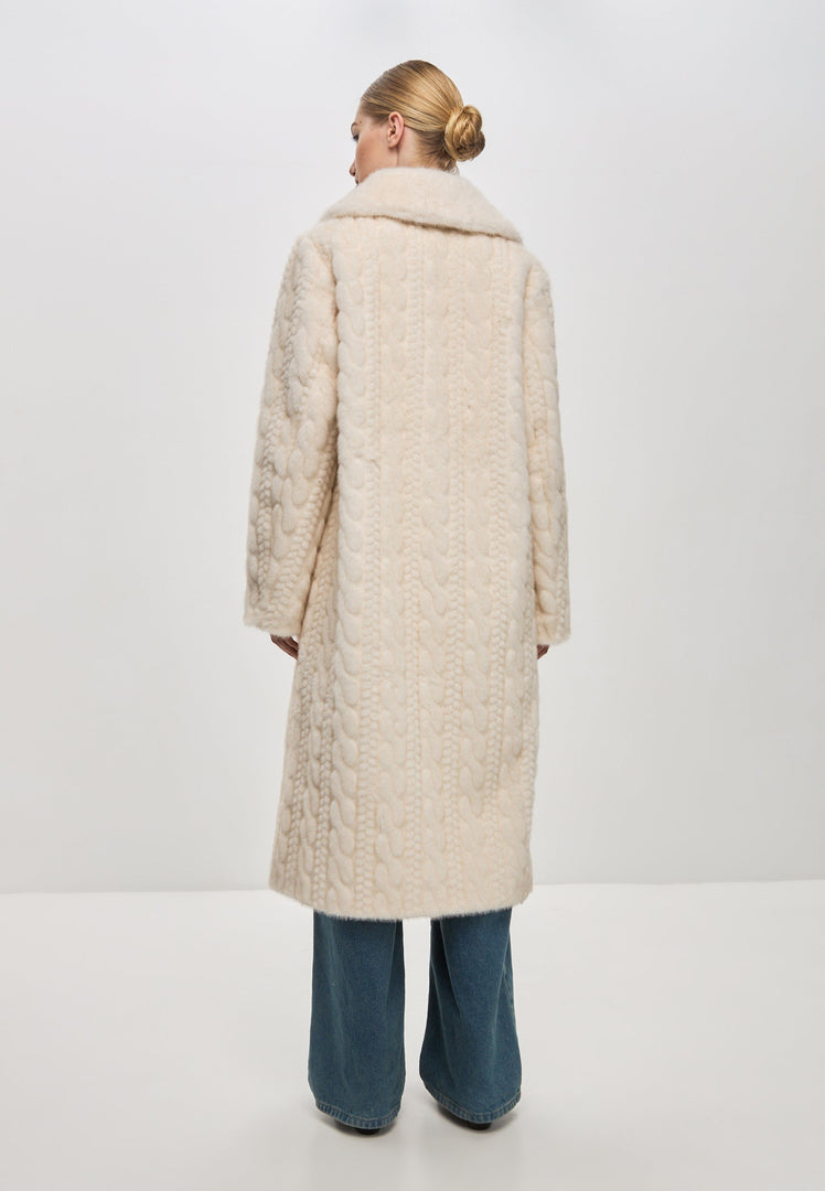 A stylish and elegant cream cable knit coat with faux fur detailing, perfect for staying warm and chic during the winter season.