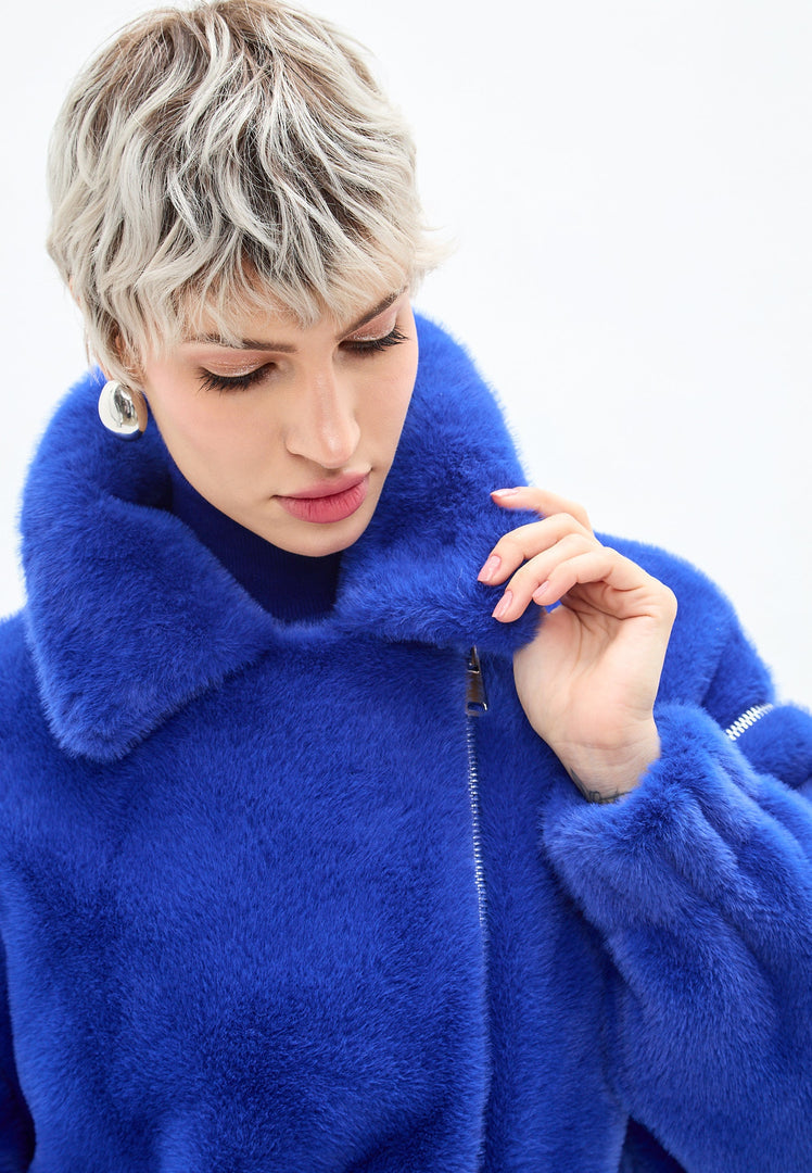 A stylish short blue faux fur coat inspired by Marilyn's style, perfect for outerwear fashion.