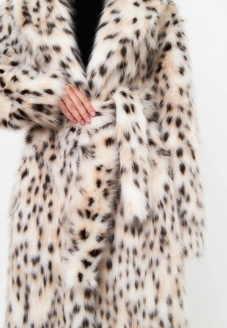 Stay stylish and warm this winter with a luxe faux fur spotted long coat, the perfect addition to your winter fashion wardrobe.