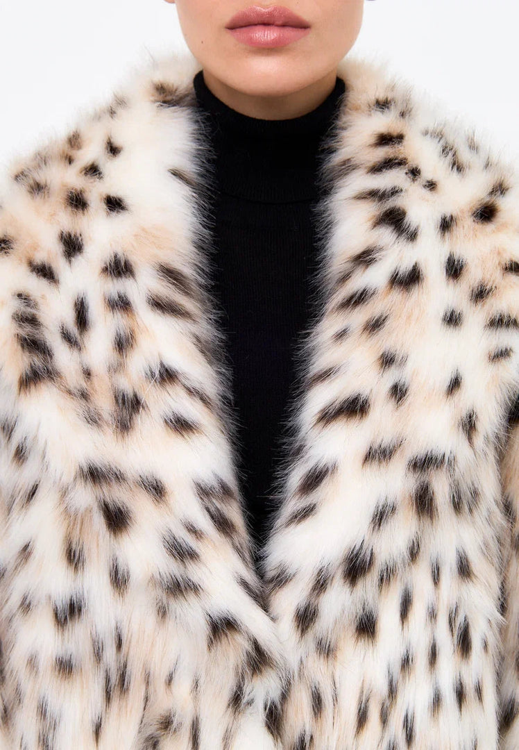 Stay stylish and cozy this season with a luxe faux fur spotted long coat, a must-have for your winter fashion wardrobe.