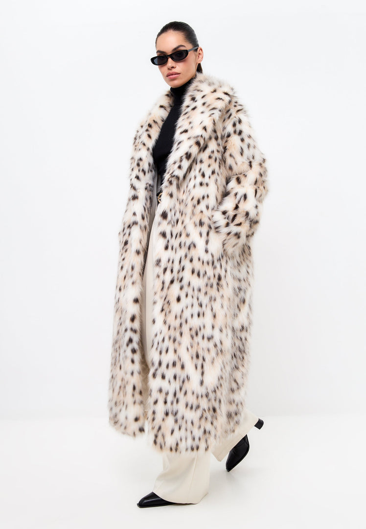 A stylish luxe faux fur long coat in spotted design for trendy winter fashion vibes.