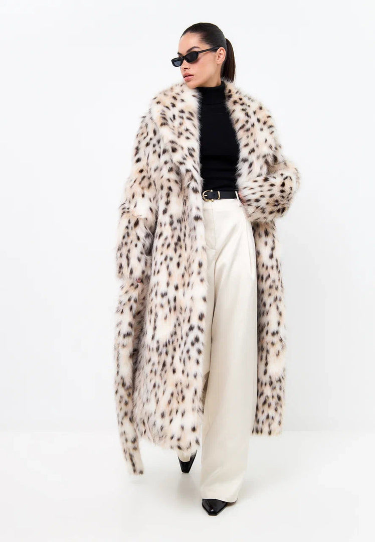 A stylish faux fur long coat in a luxe spotted design, perfect for winter fashion.
