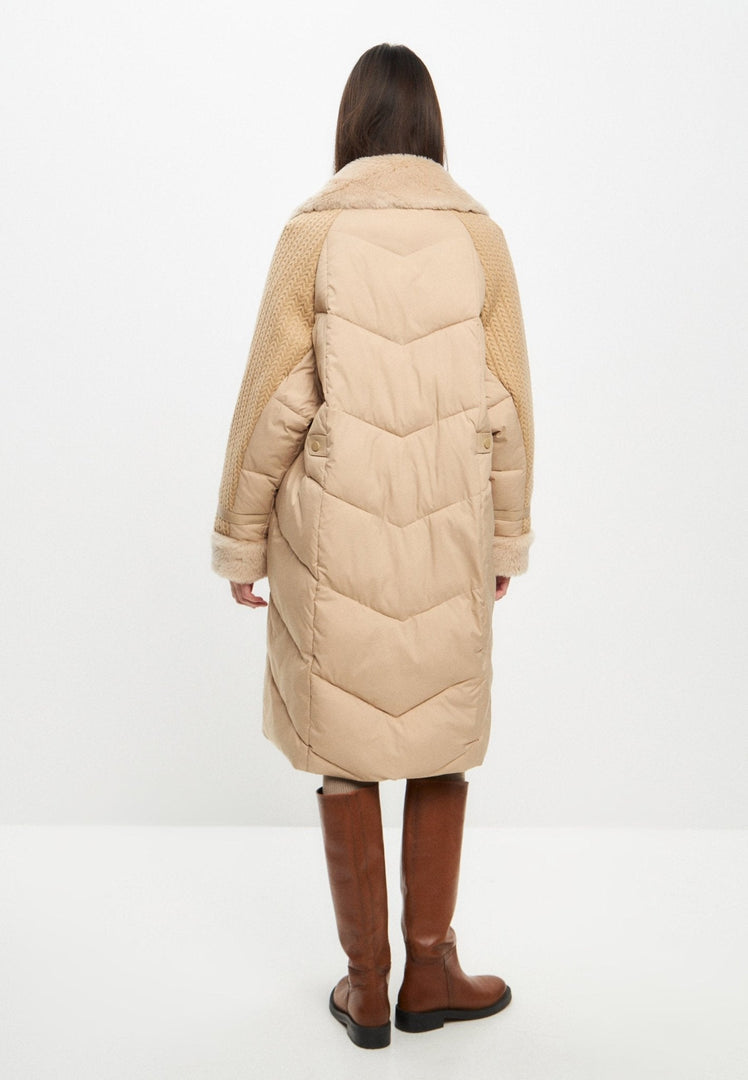 A chic beige long quilted coat in an oversize style, perfect as a winter jacket for women's outerwear fashion.