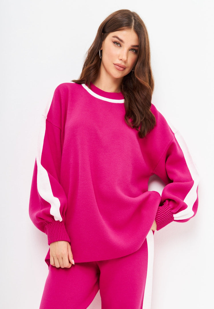 A cozy and stylish pink knitted jogger set for women, perfect for a casual knitwear outfit.