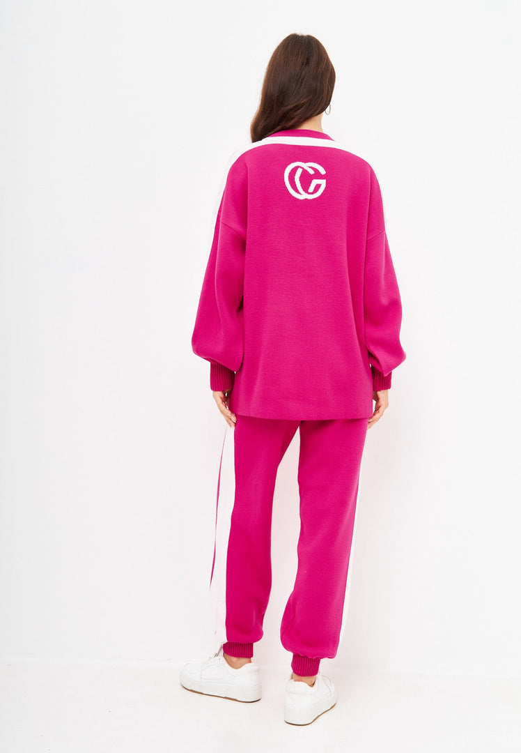A cozy and stylish pink knitted jogger set for women, perfect for a casual knitwear outfit, also known as a CG pink co-ord set.