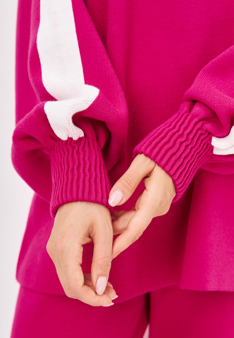 A stylish pink knitted jogger set for women, a perfect casual knitwear outfit for any occasion.