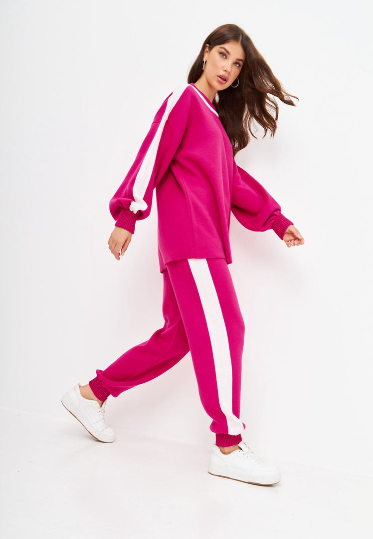 A cozy and stylish women's pink knitted jogger set, perfect for a casual knitwear outfit.
