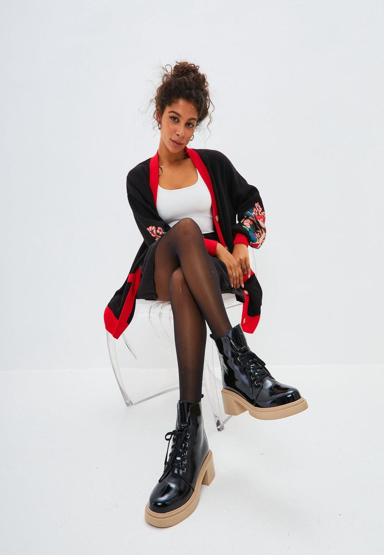 An image of a cozy, oversized puffy sleeve cardigan knitted with chunky yarn, perfect for staying warm and stylish.