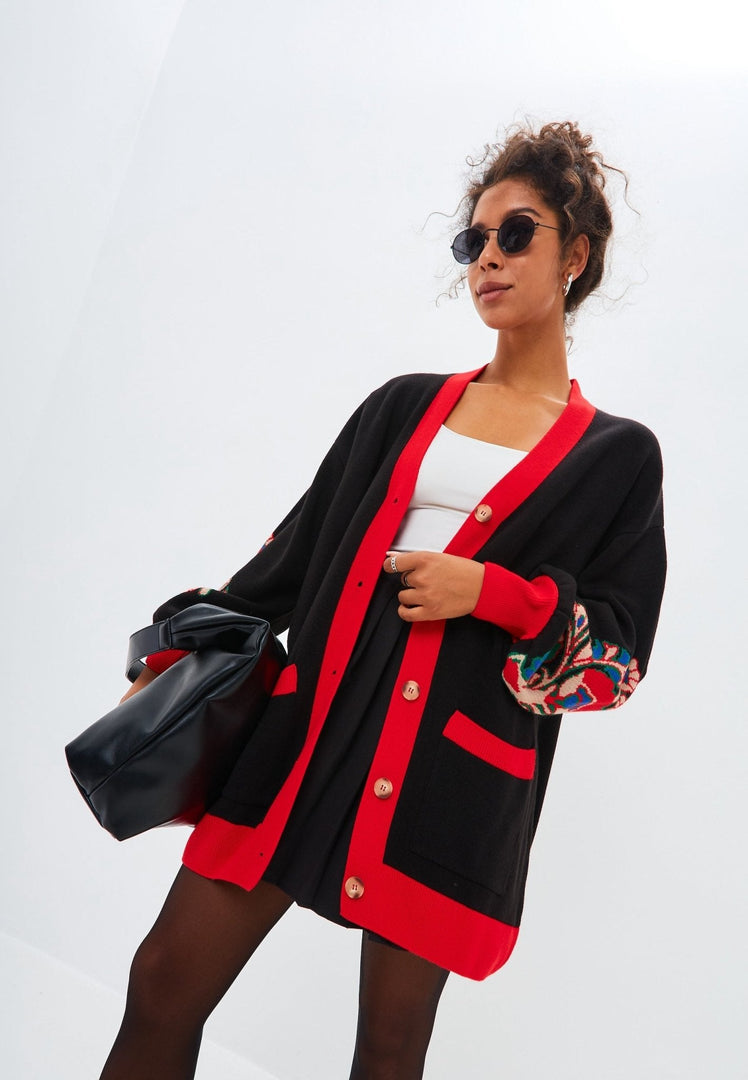 A cozy and trendy oversized chunky knit cardigan with puffy balloon sleeves for ultimate comfort and style.